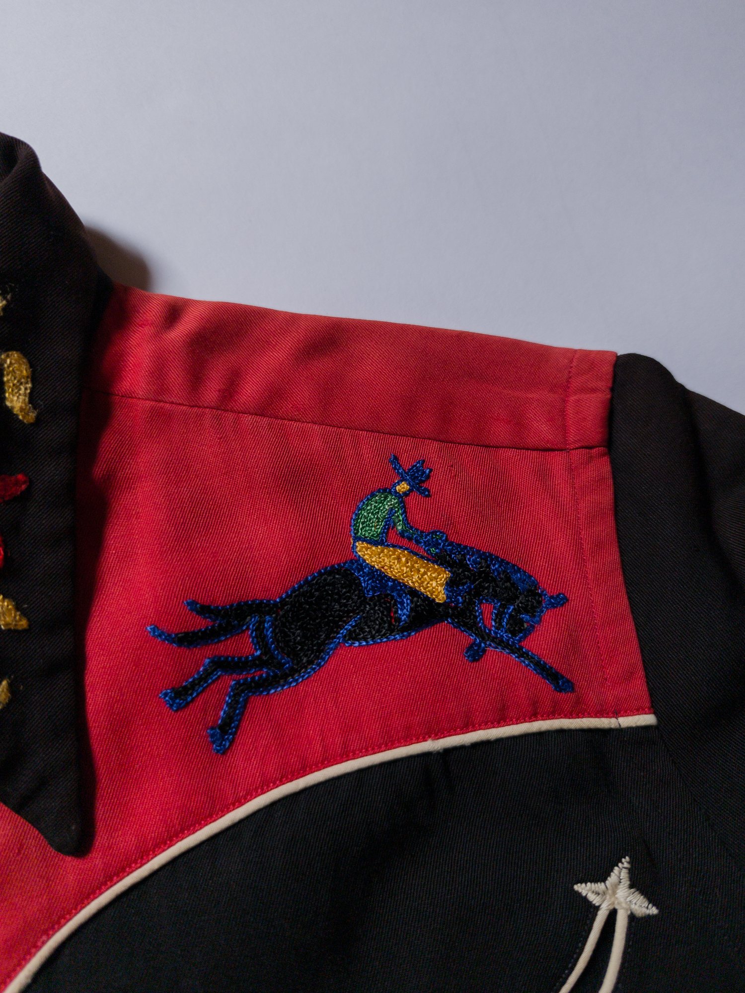 1950s chain-stitched cowboy on a gabardine western shirt.